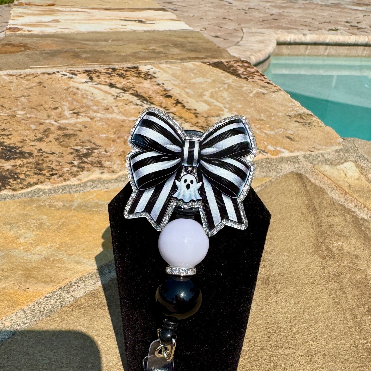 Spooky Season Bow Badge Reel